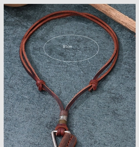Detail view of 81cm brown leather cord necklace with vintage metal triangle pendant