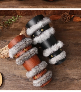Detail of Viking style faux leather arm guards with rabbit fur and golden metal rivets