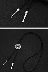 Detail of sunflower metal slide and engraved silver tips on black leather bolo tie