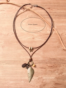 Retro bohemian double-layer necklace detail with feather charms and wooden beads