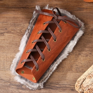Vintage Viking leather bracer with warm grey faux fur lining and lace-up closure