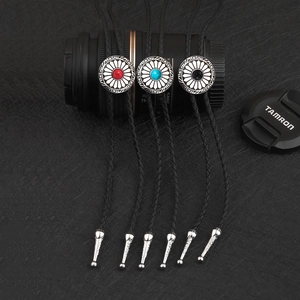 Three vintage style bolo ties with sunflower metal buckles and inlaid colored gemstones