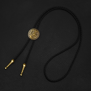 Vintage bronze flower bolo tie with black braided leather cord and metallic tips