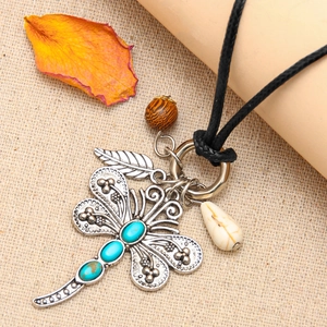 Bohemian dragonfly necklace with turquoise, hollow leaf, and beads on black cord