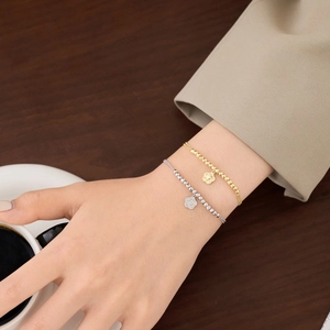 Elegant S925 sterling silver beaded bracelet with floral pendant in gold and silver finish