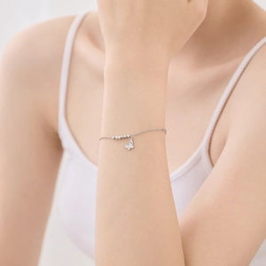 Detailed view of an S925 sterling silver bracelet featuring a zircon butterfly pendant