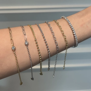 S925 sterling silver chain bracelets layered on wrist with gold and zircon accents
