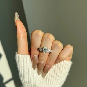 Macro shot of 2ct oval moissanite ring with micro-pave setting on S925 silver band