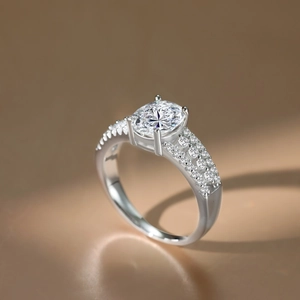 Macro shot of oval 2ct moissanite ring with triple row pavé diamonds in 925 silver