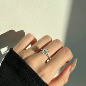 Macro shot of 3ct oval-cut moissanite ring in S925 silver with classic 4-prong setting