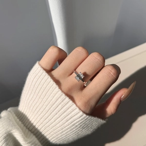Macro shot of 2 carat emerald cut moissanite ring set in S925 sterling silver band
