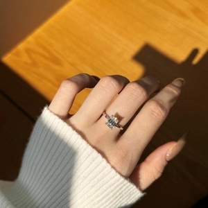 Detailed view of 2-carat emerald cut moissanite ring with S925 sterling silver band