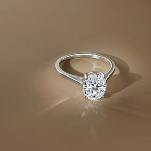 Close-up of S925 silver ring featuring a 3-carat oval-cut moissanite stone in 4-prong setting
