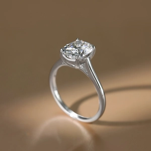 Detailed close-up of 3-carat oval moissanite ring in four-prong S925 silver setting