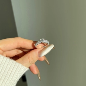 S925 sterling silver ring featuring a large heart-cut moissanite and pave diamond band