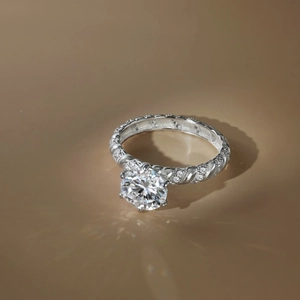 Detailed close-up of a 2ct moissanite ring with twisted band and six-prong setting