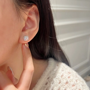 Elegant square moissanite stud earrings in S925 sterling silver worn by a model