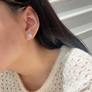 Square halo moissanite stud earrings in S925 sterling silver worn by a model