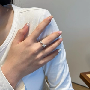 Detail of S925 silver double butterfly ring featuring pavé-set moissanite stones