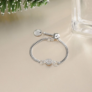 Detail of adjustable S925 sterling silver chain ring with round zircon on silk background