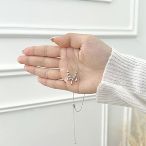 Detailed view of S925 sterling silver necklace with beads and teardrop pendants