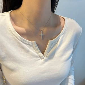 Detail of S925 sterling silver cross pendant necklace with sparkling moissanite diamonds