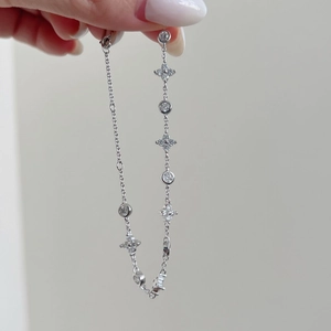 Elegant S925 sterling silver bracelet featuring four-pointed stars and round zircon charms