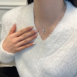 Detailed view of S925 sterling silver cross pendant necklace with sparkling pavé stones