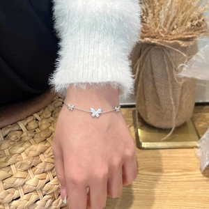 Detailed view of S925 sterling silver butterfly bracelet with shimmering moissanite inlay