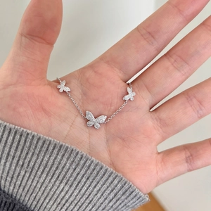 Detailed view of S925 sterling silver butterfly bracelet with sparkling moissanite stones