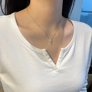Detail of S925 silver necklace with marquise-cut floating moissanite on neck