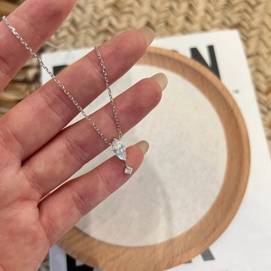 Handheld view of S925 sterling silver necklace with marquise-cut 1.1CT moissanite pendant