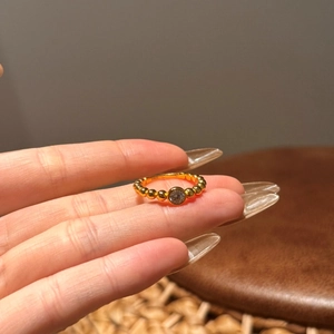 Bague en argent S925 plaqué or avec perles et une pierre centrale en zircone brillante