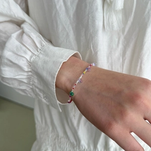 Colorful S925 sterling silver beaded bracelet with adjustable chain on model's wrist
