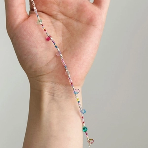 Detailed close-up of S925 silver bracelet with colorful rainbow crystal beads design