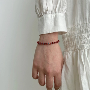 S925 sterling silver bracelet with red agate and blue apatite beads on a female wrist
