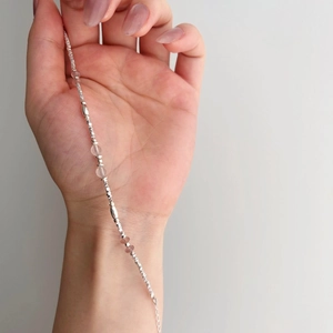 Detail view of S925 sterling silver bracelet with pink strawberry quartz and crystal beads