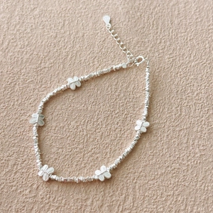 S925 sterling silver butterfly bracelet featuring textured beads and five delicate charms