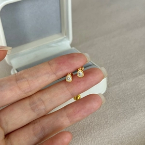 Detailed view of pear-cut crystal earrings in gold-plated S925 sterling silver setting