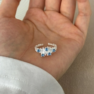 Irregular S925 sterling silver open ring with blue zircons and textured finish