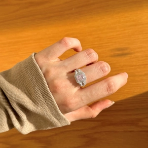 Close-up of S925 silver ring featuring square pink gemstone and pavé diamonds