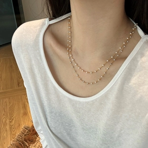 Minimalist S925 sterling silver layered crescent and star necklace on a model