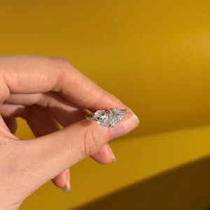 Exquisite S925 sterling silver ring with double pear-cut diamonds and pavé band