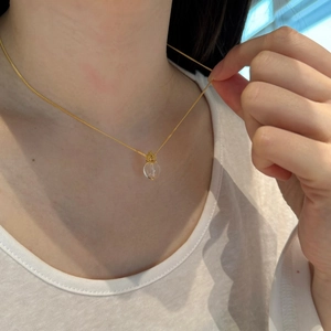 Elegant gold S925 silver necklace featuring a natural white crystal flower pendant
