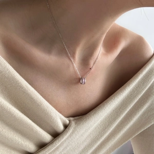 Minimalist S925 silver necklace with a cylinder pendant inlaid with pink rectangle zircons