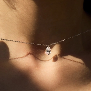 Minimalist S925 silver necklace featuring a sparkling pear-cut zircon pendant on a fine chain