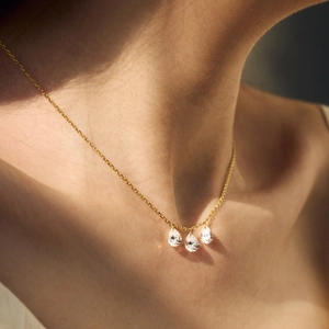Elegant gold S925 sterling silver necklace with three sparkling teardrop crystal pendants