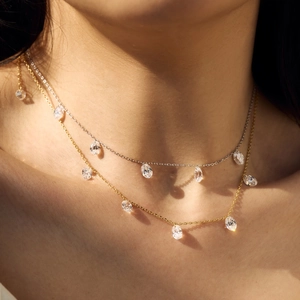 Elegant S925 sterling silver layered necklace featuring delicate oval crystal pendants