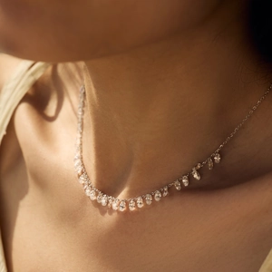 Elegant S925 silver necklace with oval zirconia drop pendants on female model