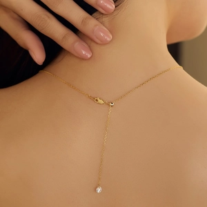 Elegant gold S925 silver necklace featuring a sparkling round zircon pendant on thin chain